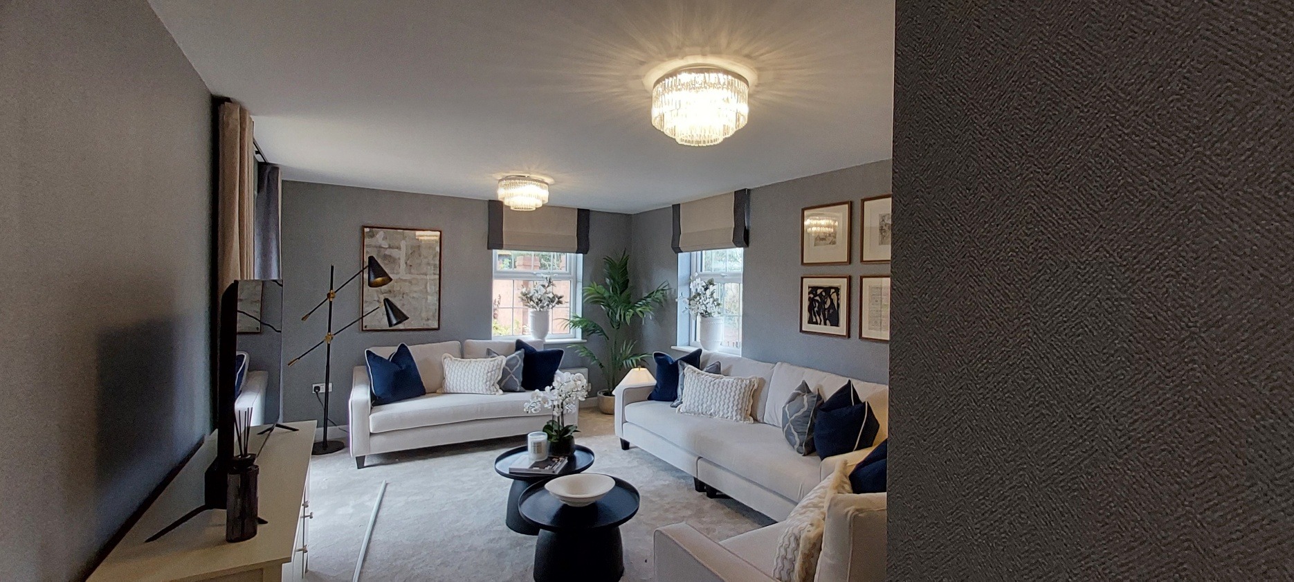 Elegant living room with neutral sofas and modern lighting